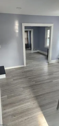 a view of a livingroom with wooden floor