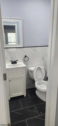 a bathroom with a toilet and a sink