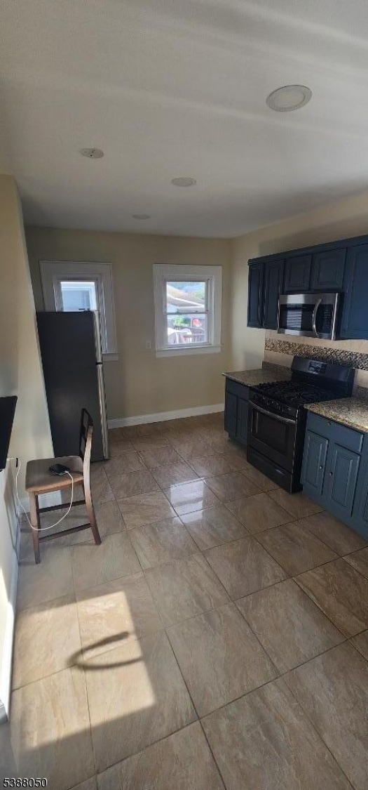 530 Drake Avenue Roselle, NJ 07203 - Photo 6 of 19 a room with furniture and a flat screen tv