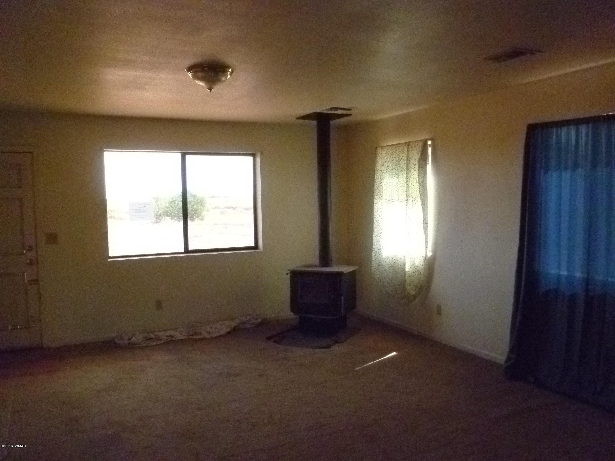 5218 Longhorn Road Snowflake, AZ 85937 - Photo 8 of 41 an empty room with windows and closet