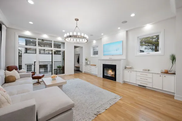 a view of a livingroom with furniture fireplace and cabinet