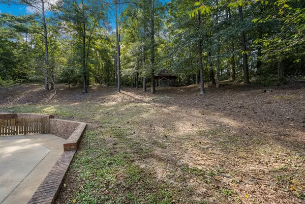 a view of a backyard with furniture