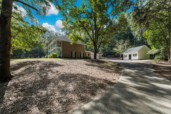 a house view with a backyard space