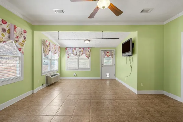 a view of a livingroom with a projector and a window