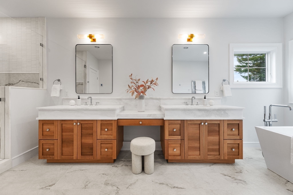 247 Broad Meadow Road Needham, MA 02492 - Photo 17 of 40 a spacious bathroom with a double vanity sink double vanity and a large mirror