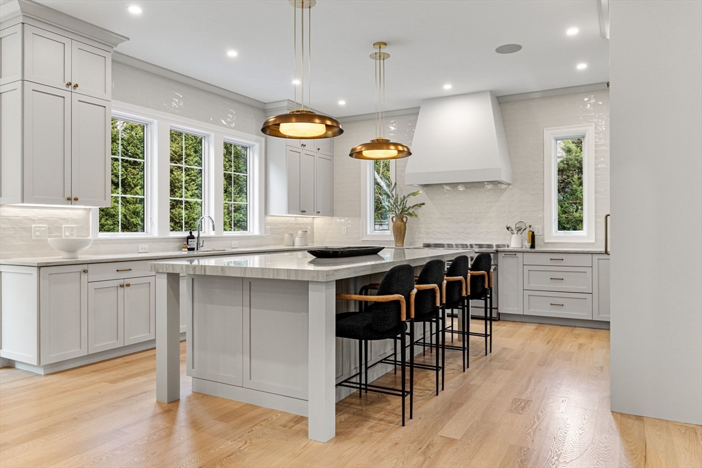 247 Broad Meadow Road Needham, MA 02492 - Photo 2 of 40 a kitchen with granite countertop a window and white cabinets
