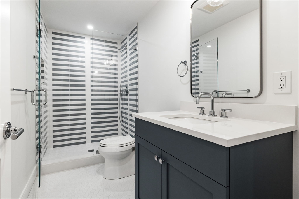 247 Broad Meadow Road Needham, MA 02492 - Photo 24 of 40 a bathroom with a sink toilet and mirror