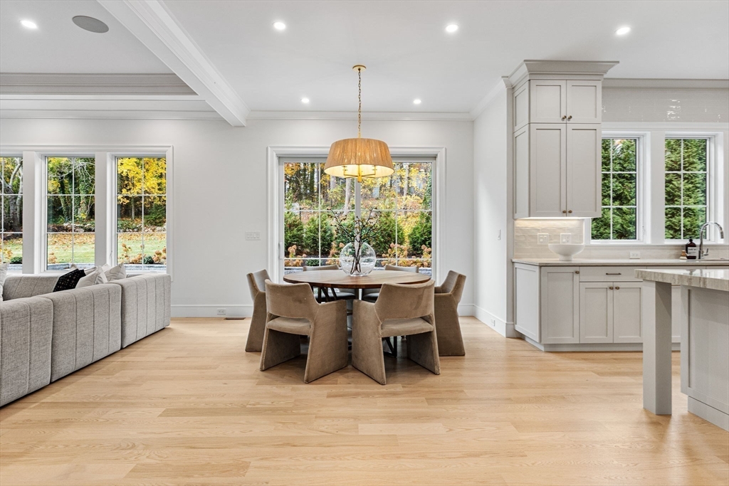 247 Broad Meadow Road Needham, MA 02492 - Photo 36 of 40 a dining room with furniture a window and a chandelier