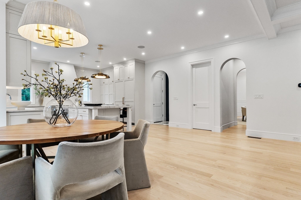 247 Broad Meadow Road Needham, MA 02492 - Photo 37 of 40 a dining room with table chairs and a chandelier