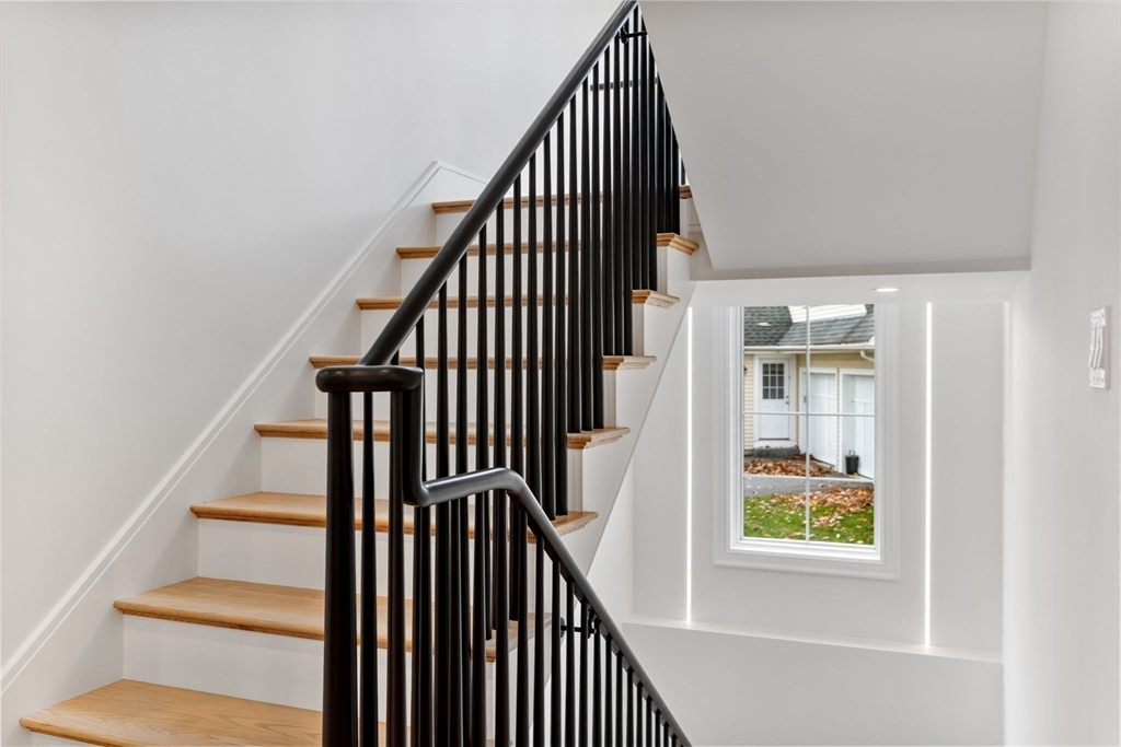 247 Broad Meadow Road Needham, MA 02492 - Photo 39 of 40 a view of entryway with wooden floor and stairs