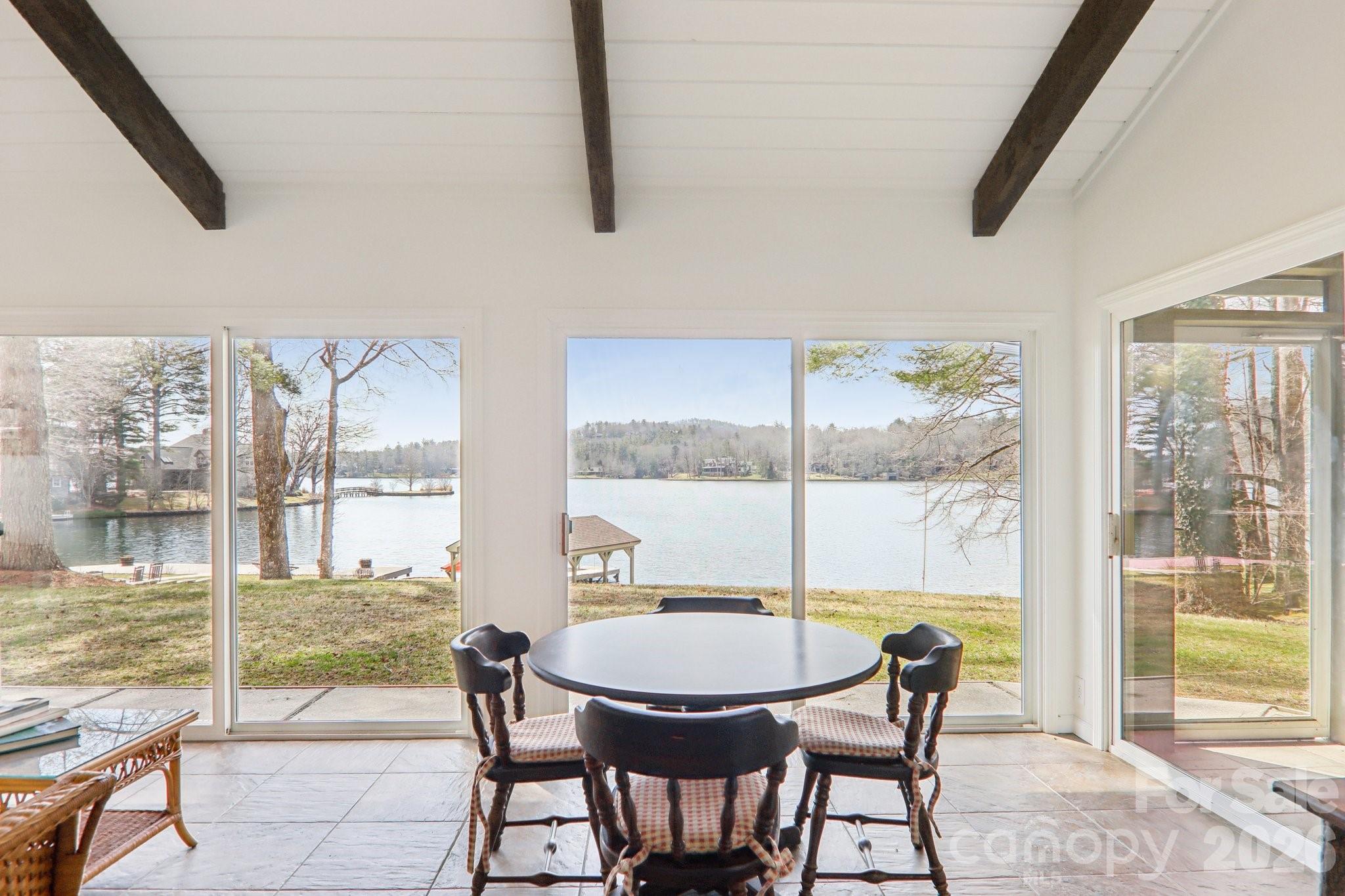 987 Cold Mountain Road Lake Toxaway, NC 28747 - Photo 24 of 42 a view of a dining room with furniture window and outside view