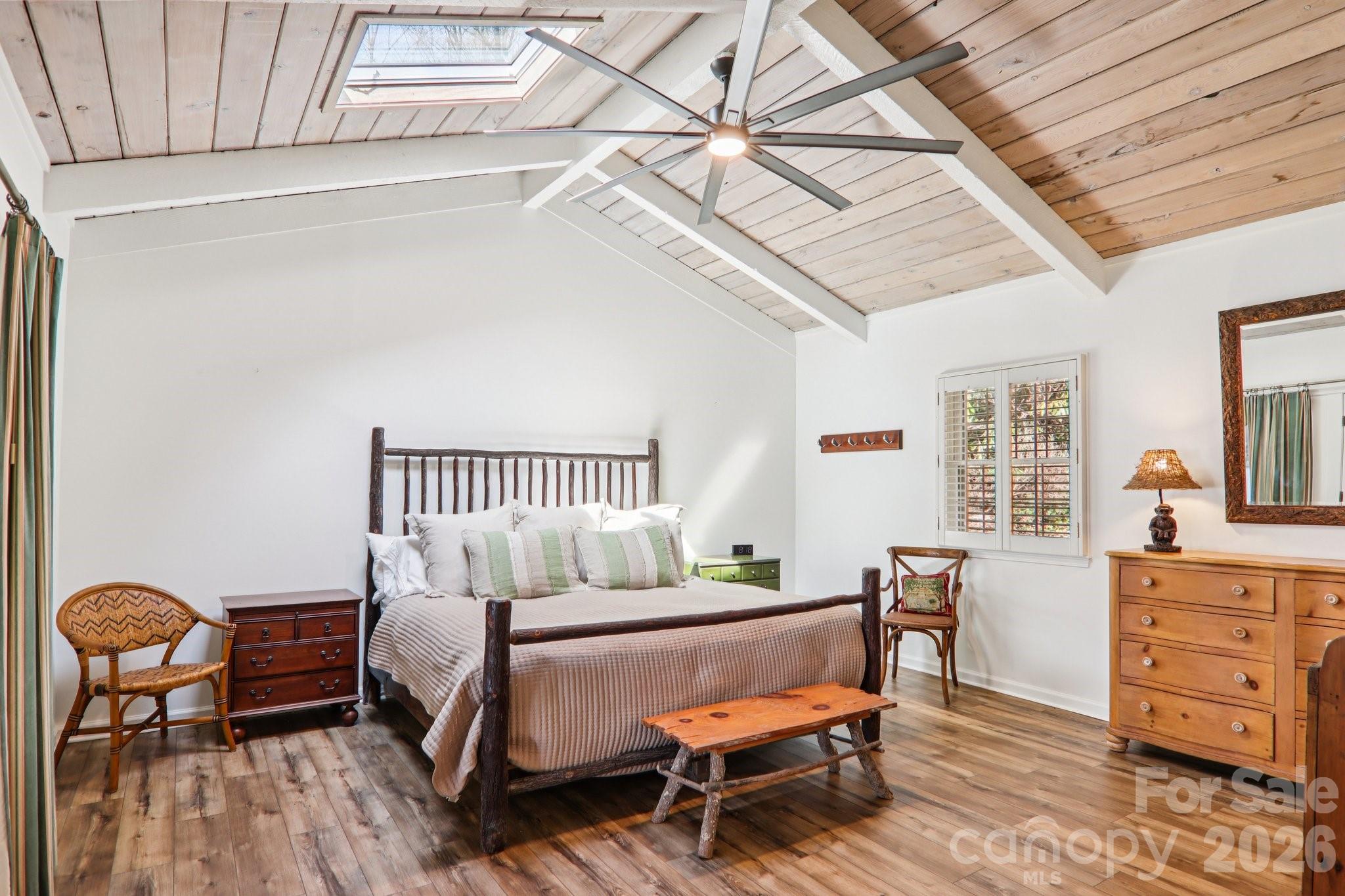 987 Cold Mountain Road Lake Toxaway, NC 28747 - Photo 28 of 42 a bedroom with furniture and wooden floor