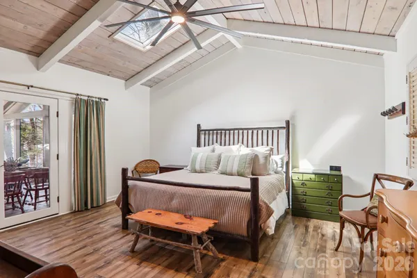 a bedroom with a bed chair and a window
