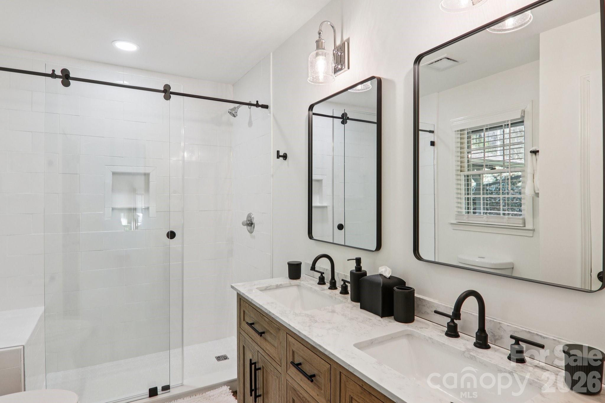 987 Cold Mountain Road Lake Toxaway, NC 28747 - Photo 31 of 42 a bathroom with a sink and a mirror
