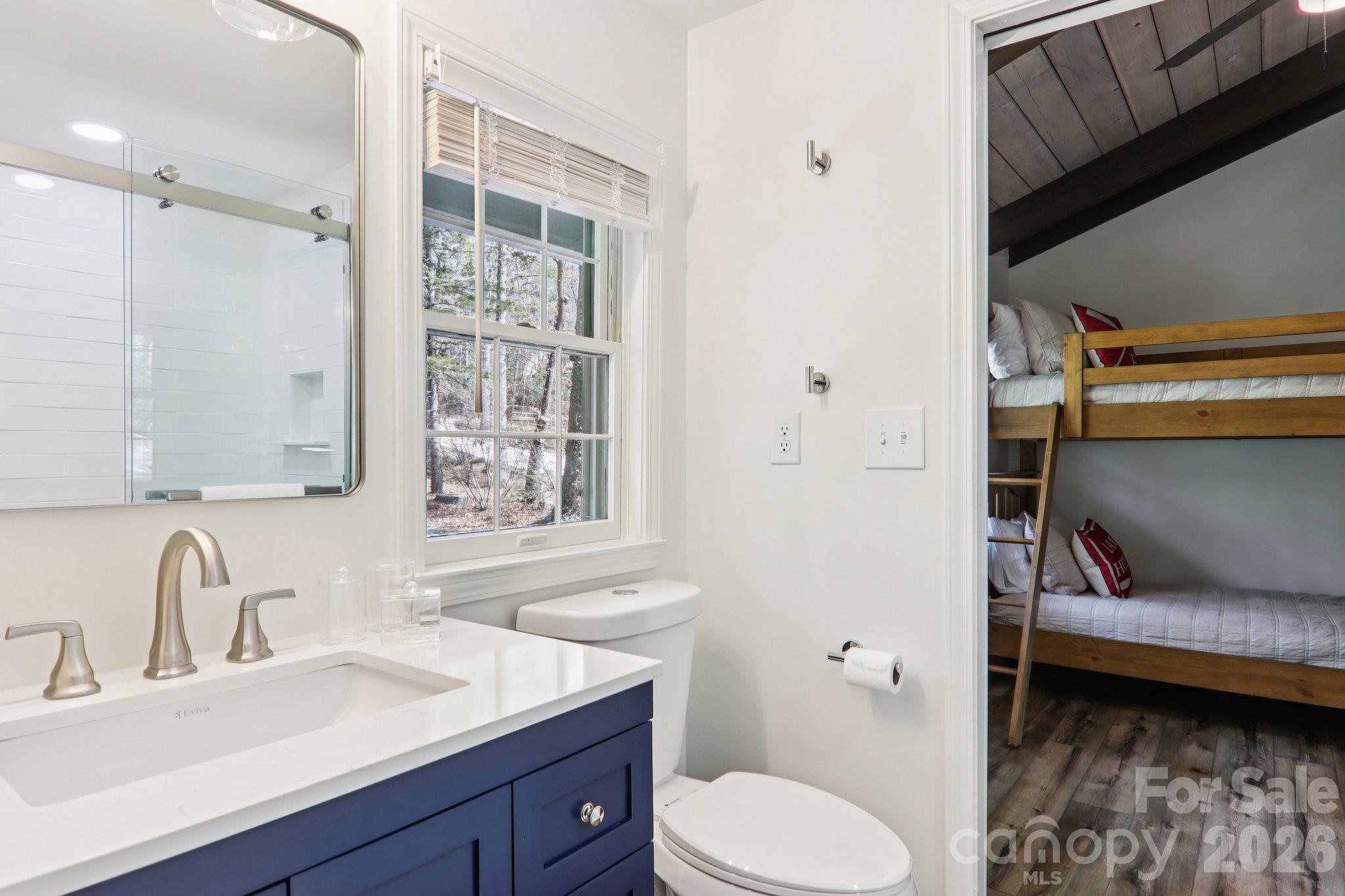 987 Cold Mountain Road Lake Toxaway, NC 28747 - Photo 34 of 42 a bathroom with a sink toilet and shower