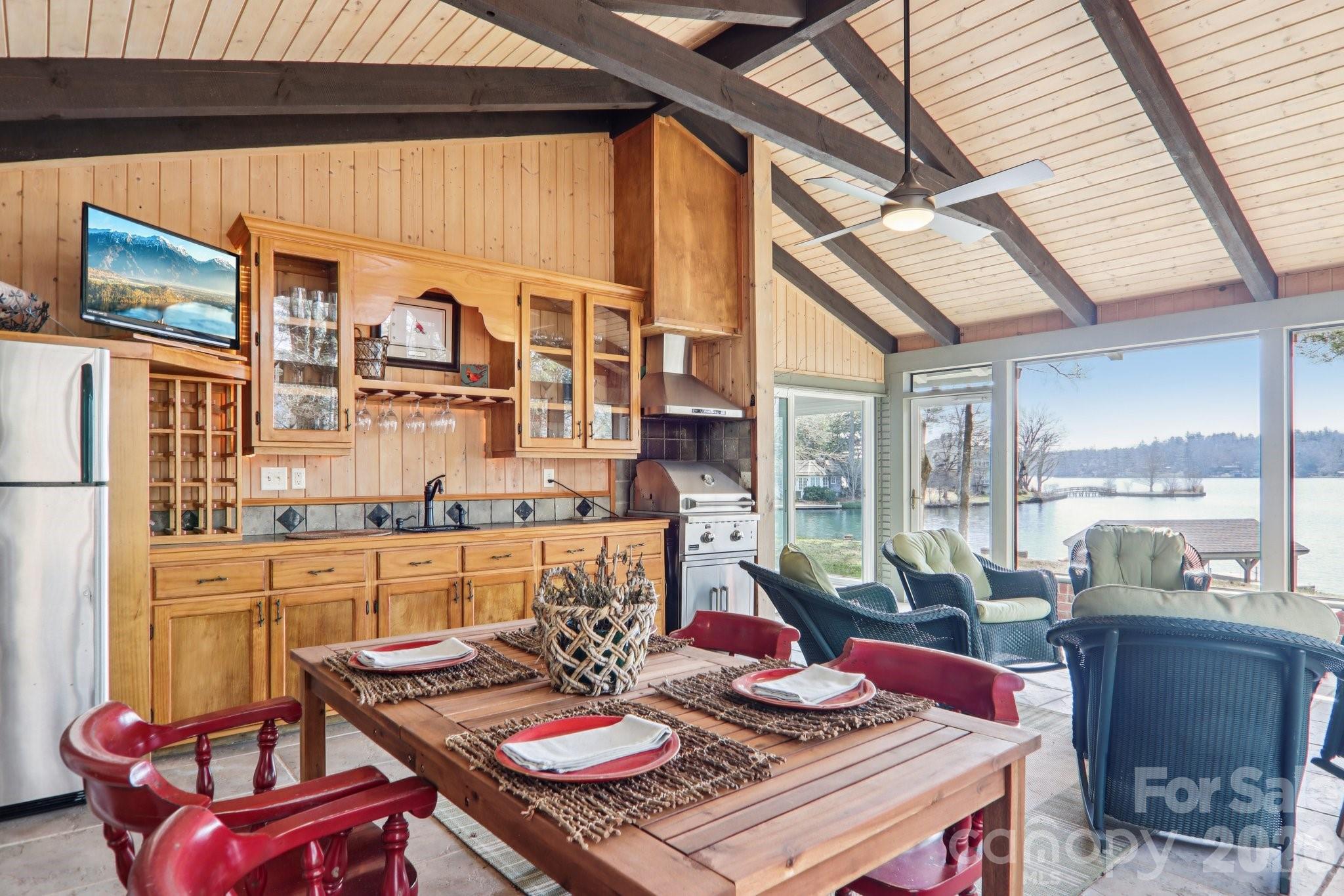 987 Cold Mountain Road Lake Toxaway, NC 28747 - Photo 39 of 42 a living room with furniture and a floor to ceiling window