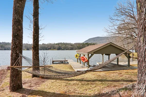 a view of a wooden deck with a yard