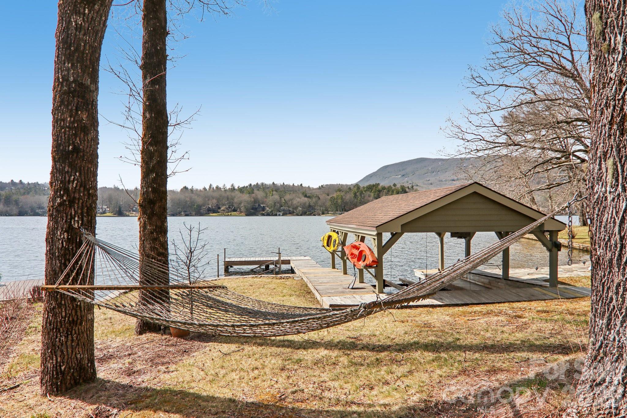 987 Cold Mountain Road Lake Toxaway, NC 28747 - Photo 5 of 42 a view of a wooden deck with a yard