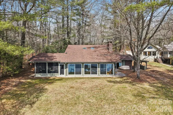 a house that has a tree in front of it