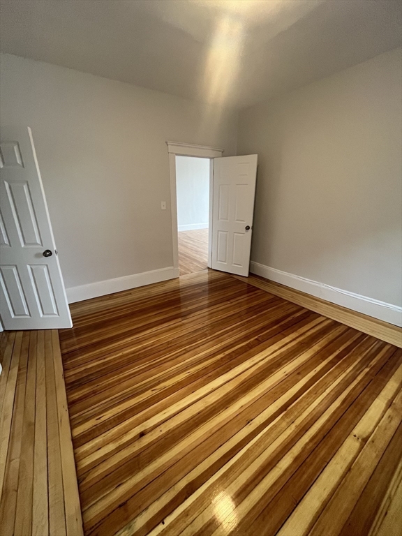 108 Bristol Road, Unit 1 Somerville, MA 02144 - Photo 20 of 30 a view of wooden floor