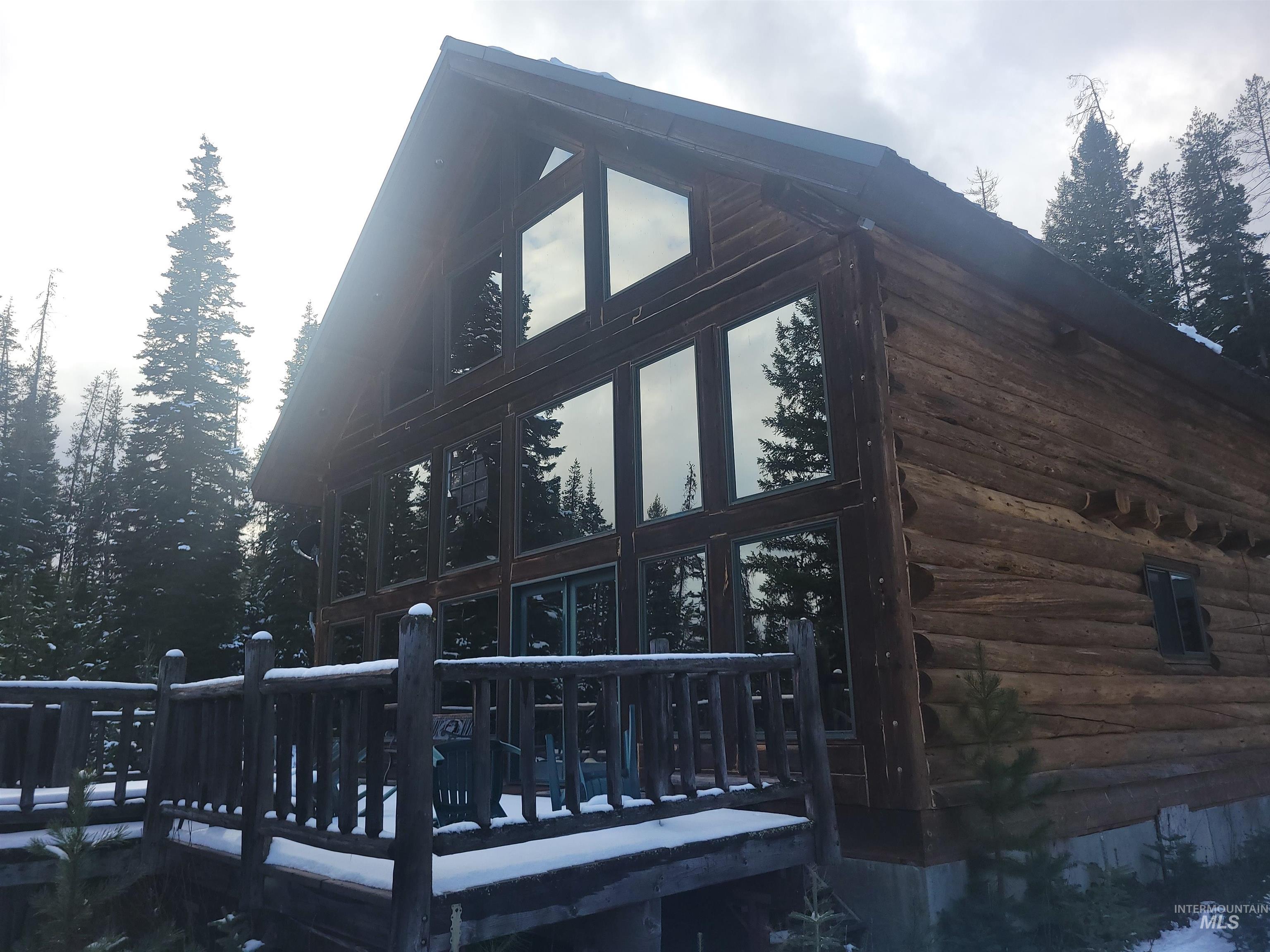 View of side of property with a deck and log exterior