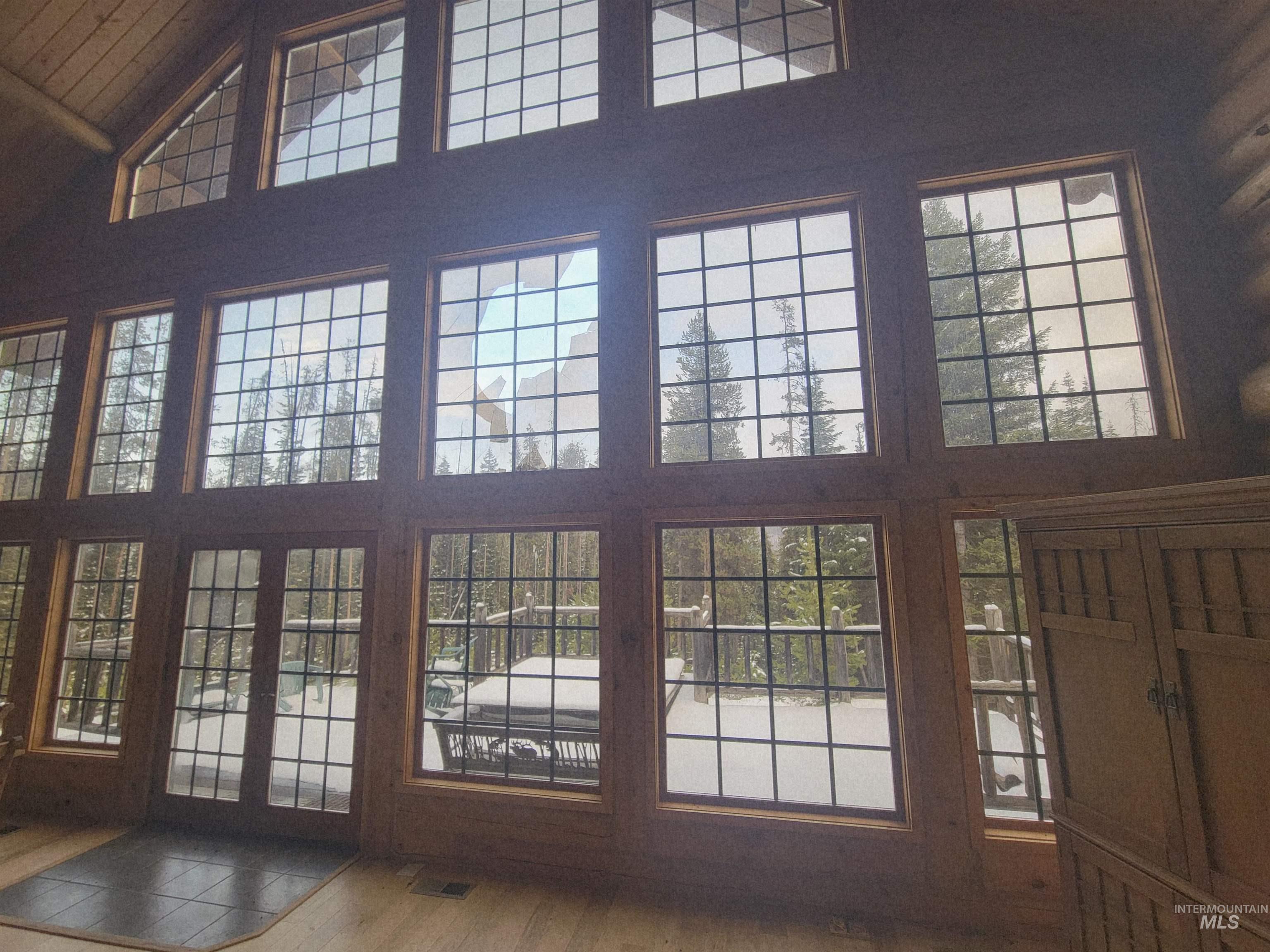 129 Copperhead Road Elk City, ID 83525 - Photo 14 of 28 Entryway featuring high vaulted ceiling, healthy amount of natural light, and wood finished floors