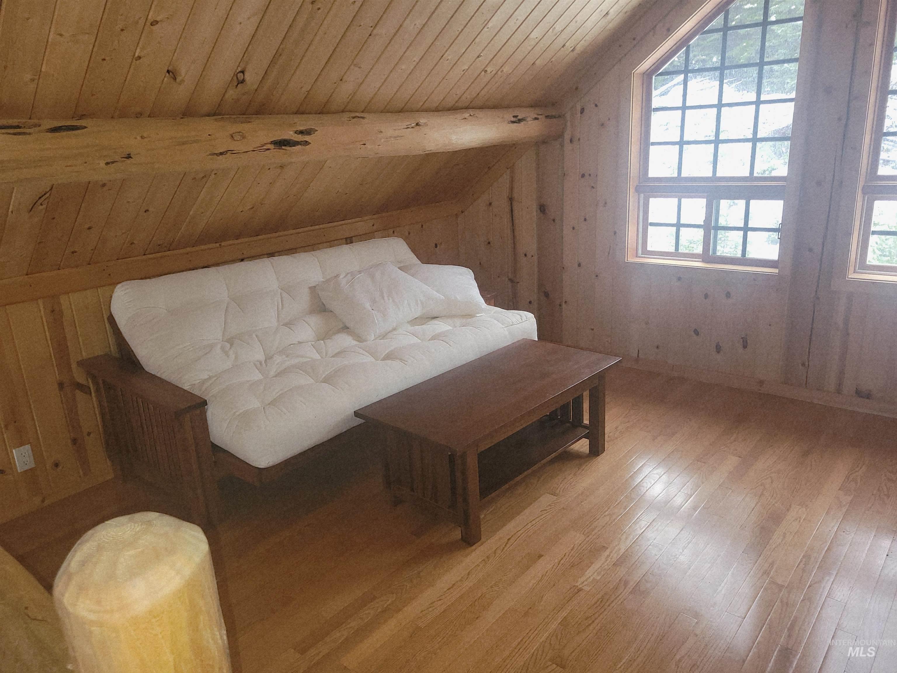 129 Copperhead Road Elk City, ID 83525 - Photo 15 of 28 Living area featuring wood ceiling and light wood-style floors
