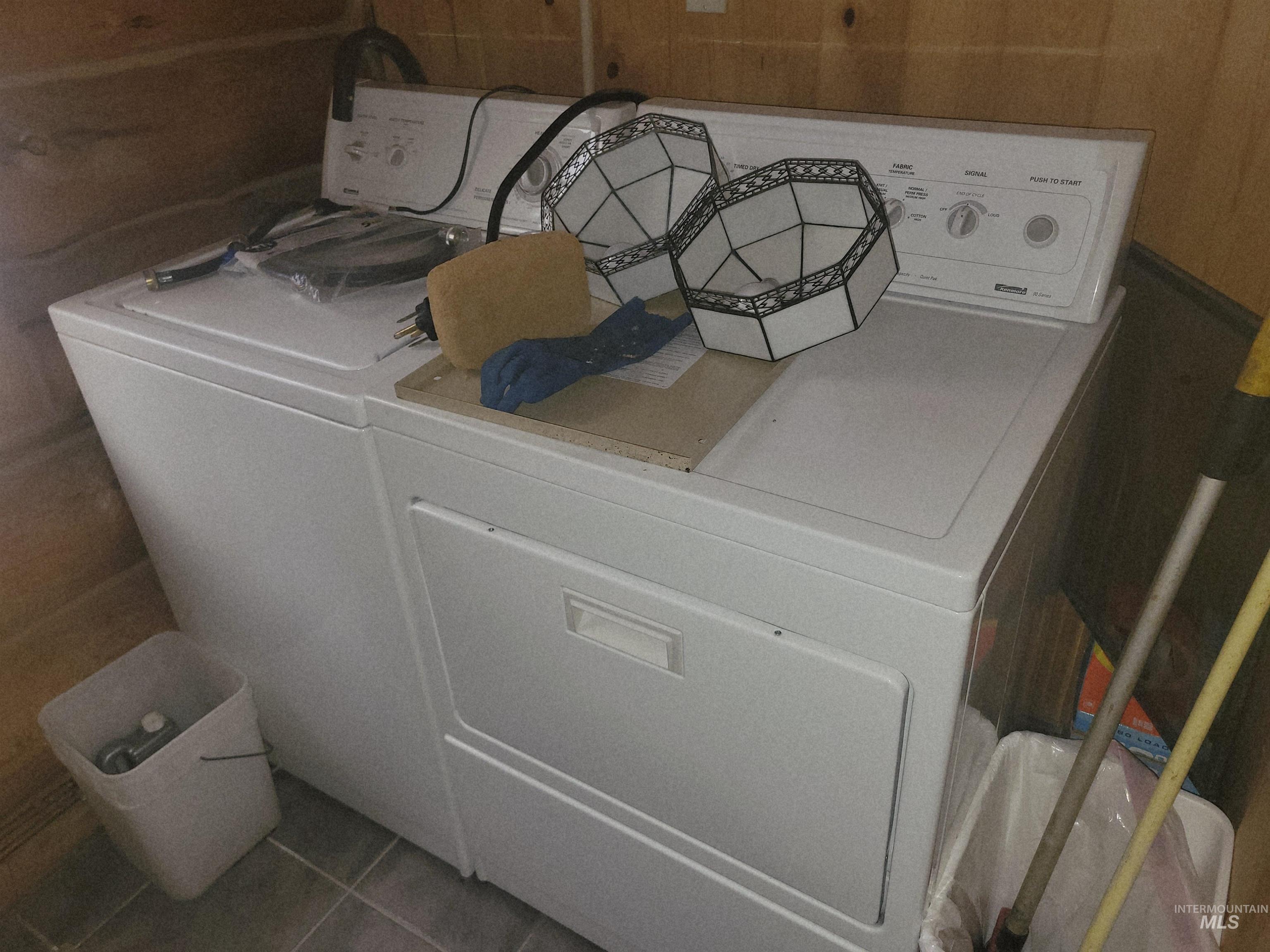 129 Copperhead Road Elk City, ID 83525 - Photo 27 of 28 Laundry room with independent washer and dryer and tile patterned flooring