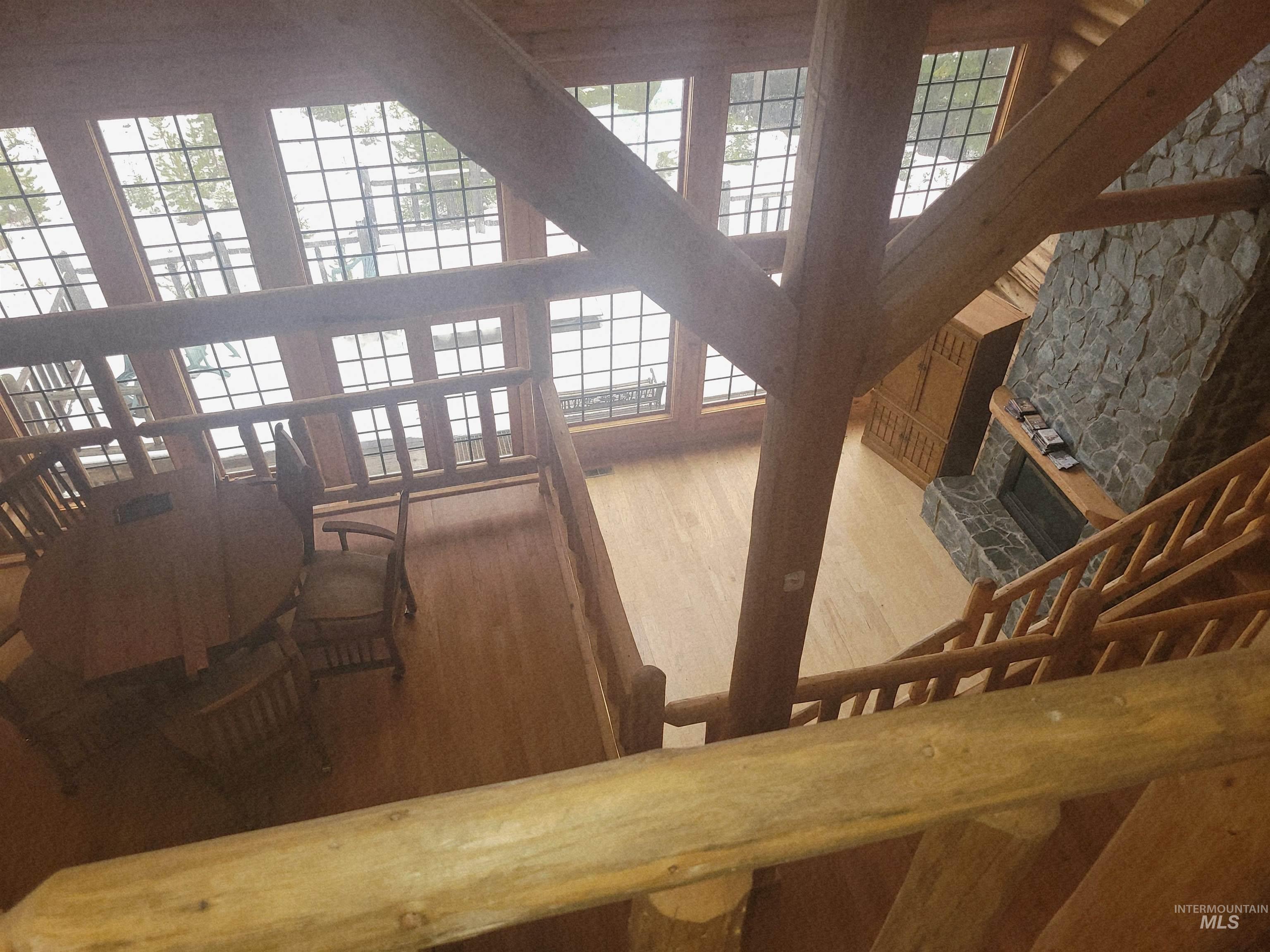 129 Copperhead Road Elk City, ID 83525 - Photo 3 of 28 Stairs featuring wood finished floors and healthy amount of natural light