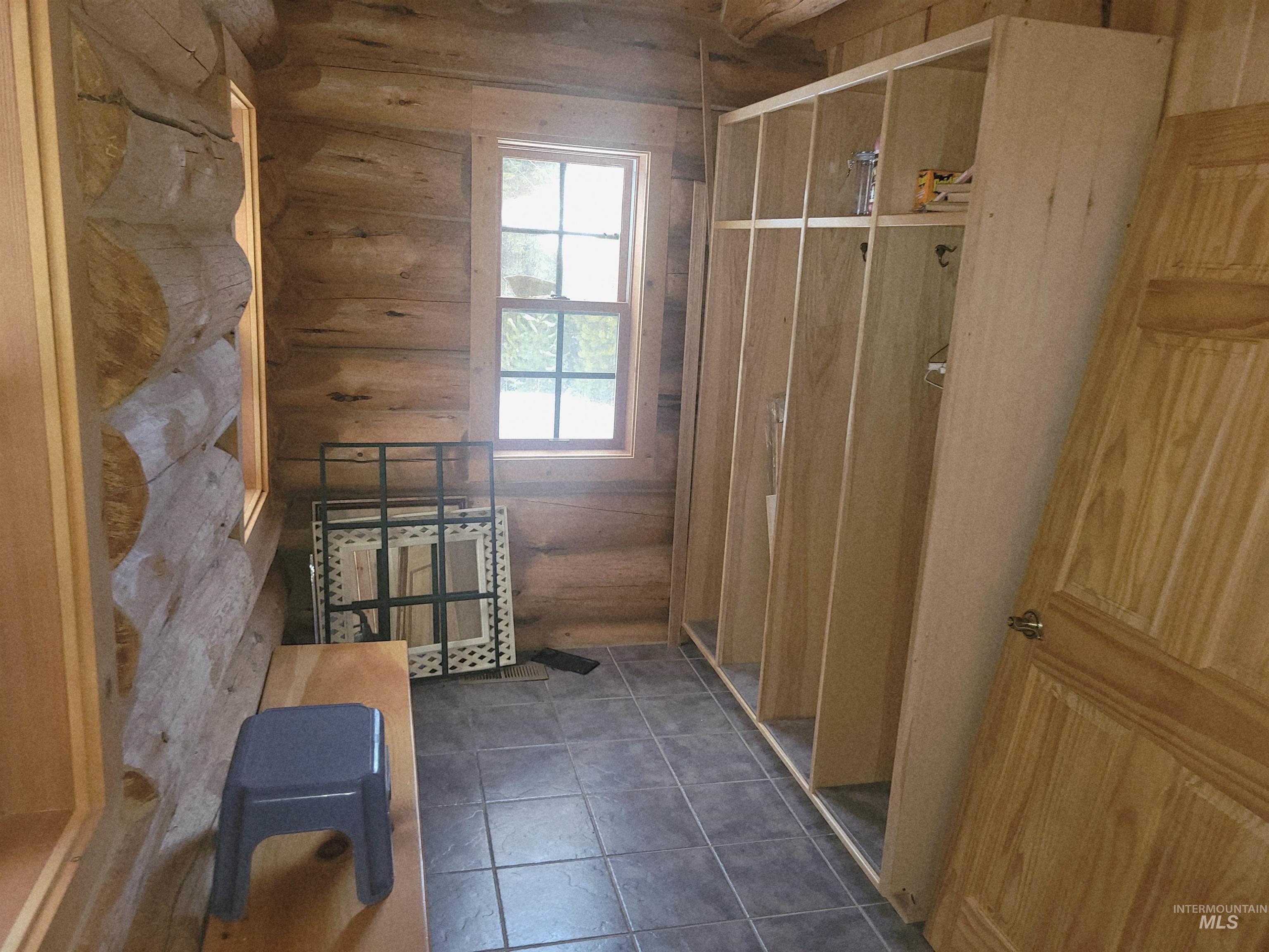 129 Copperhead Road Elk City, ID 83525 - Photo 10 of 28 Doorway to outside with tile patterned floors