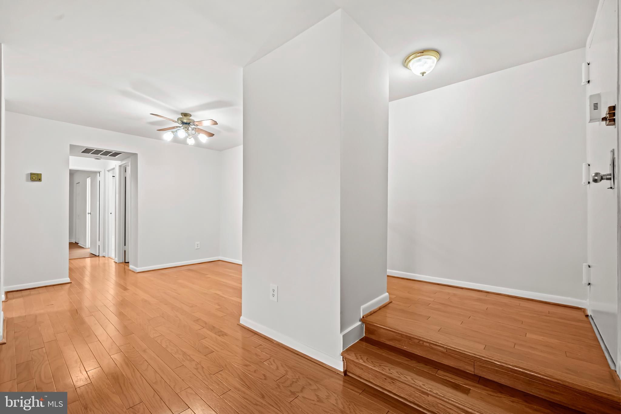 11200 Chestnut Grove Square, Unit 203 Reston, VA 20190 - Photo 11 of 41 a view of a room with wooden floor