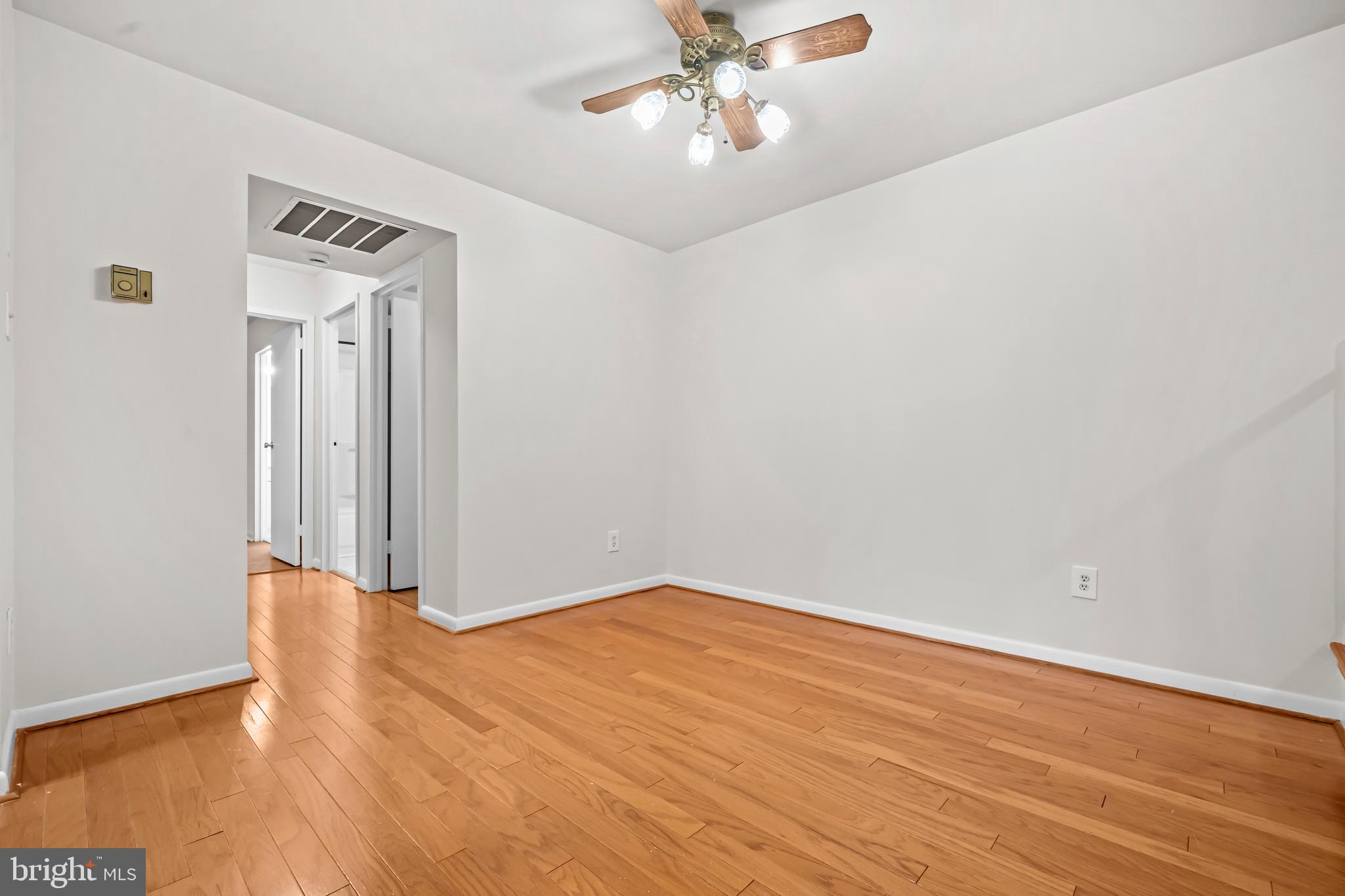 11200 Chestnut Grove Square, Unit 203 Reston, VA 20190 - Photo 12 of 41 wooden floor in an empty room