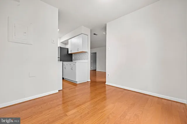 a view of a kitchen with wooden floor