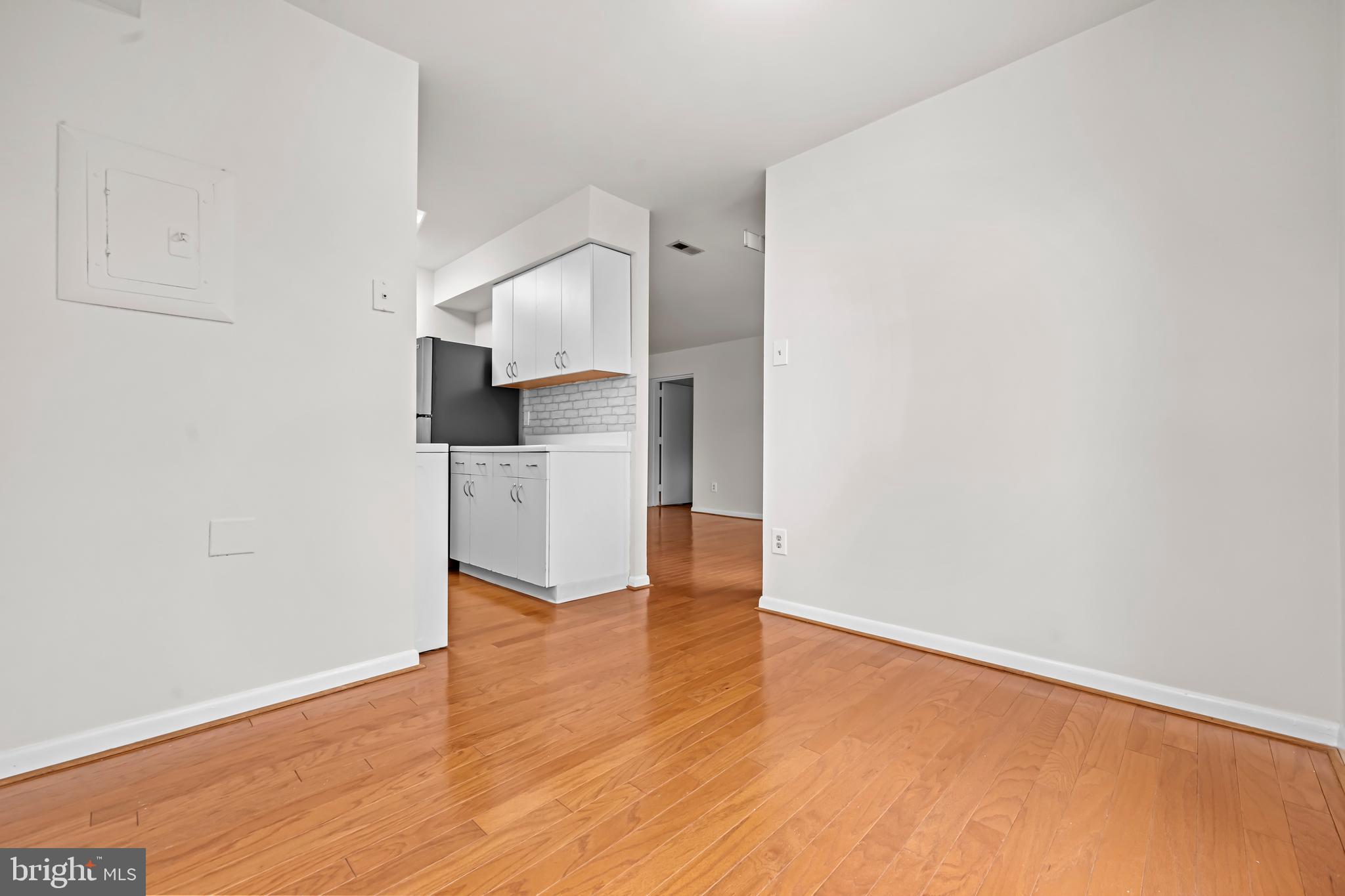 11200 Chestnut Grove Square, Unit 203 Reston, VA 20190 - Photo 20 of 41 a view of a kitchen with wooden floor