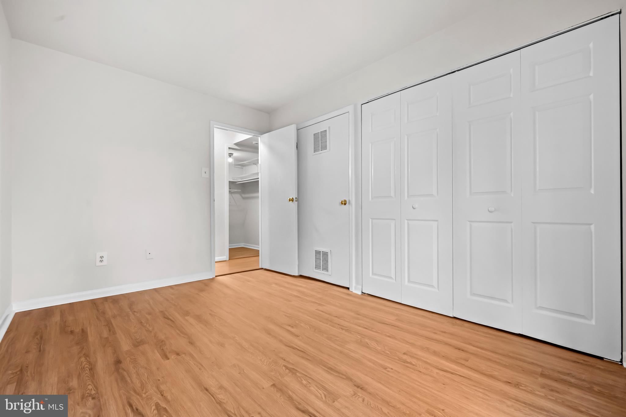 11200 Chestnut Grove Square, Unit 203 Reston, VA 20190 - Photo 26 of 41 a view of a room with wooden floor
