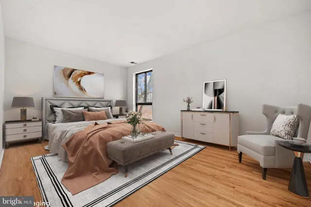 a bedroom with a bed and white walls