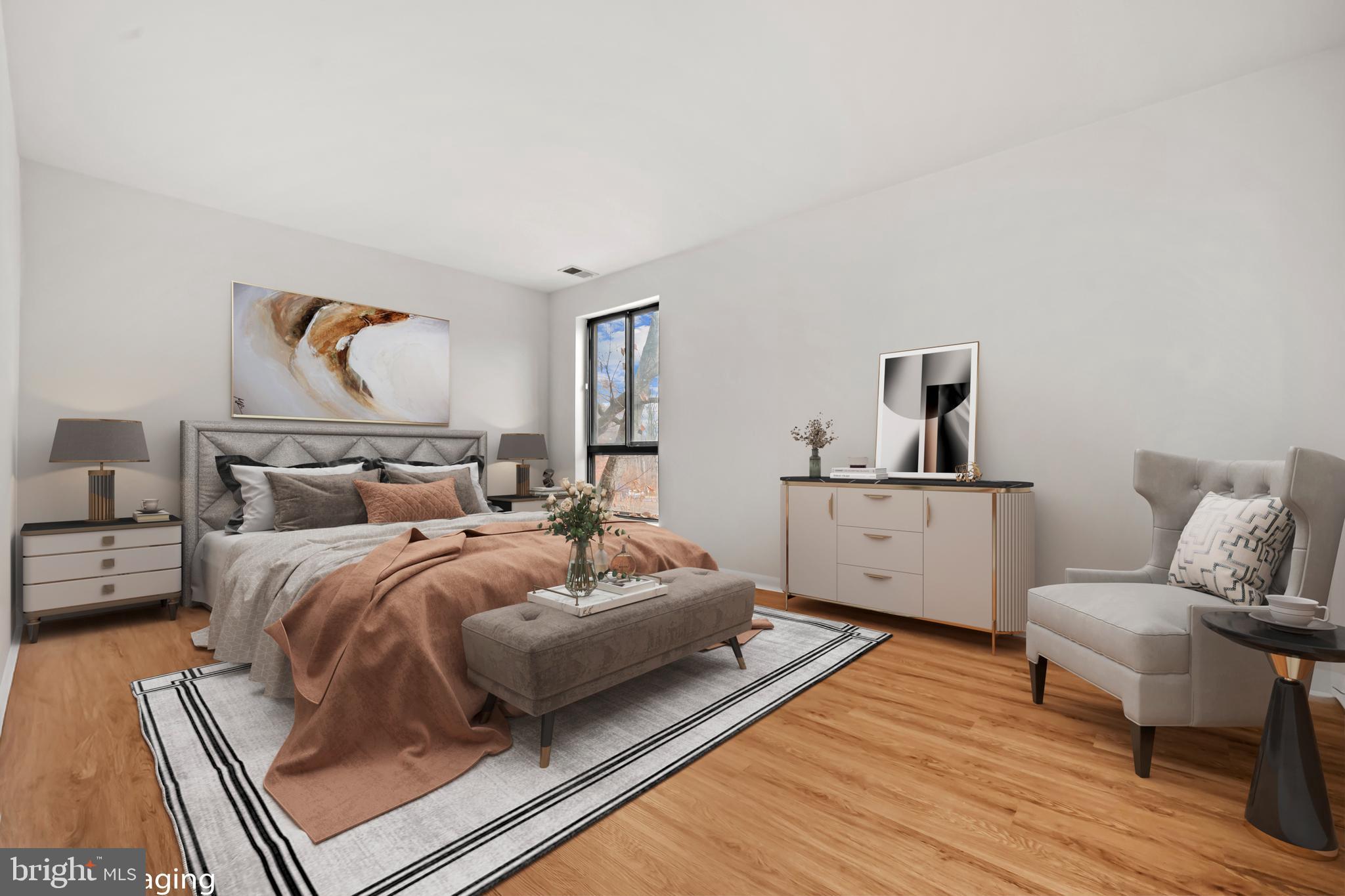 11200 Chestnut Grove Square, Unit 203 Reston, VA 20190 - Photo 27 of 41 a bedroom with a bed and white walls