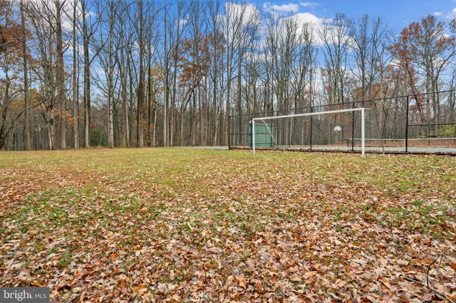 a white house with a trees in front of it