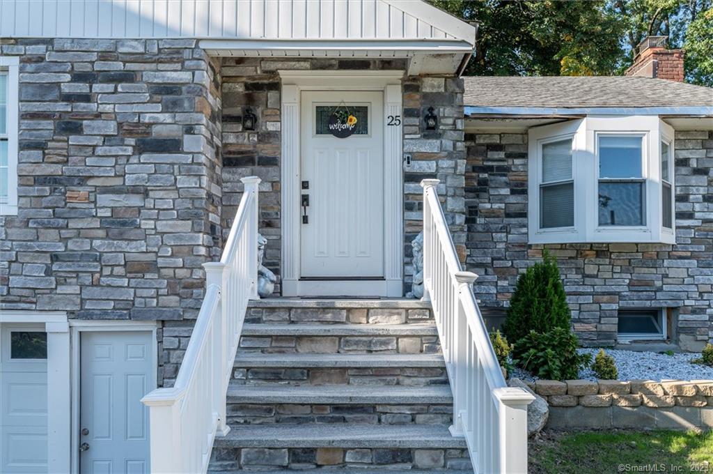 a front view of a house with stairs