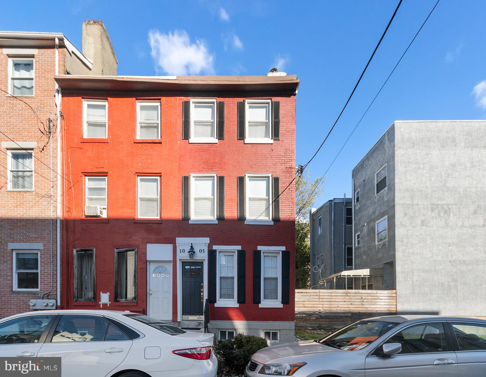 1005 Mt Vernon Street Philadelphia, PA 19123 - Photo 1 of 35 a front view of a building with parking space and a street view
