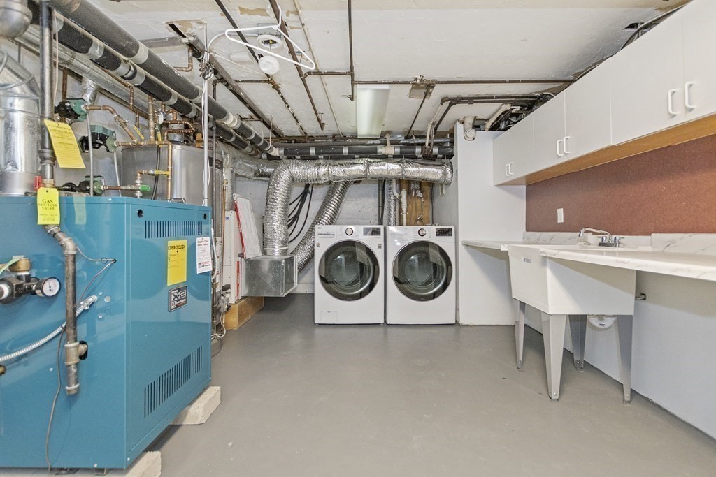 9 Larch Road Newton, MA 02468 - Photo 29 of 34 a utility room with dryer and washer