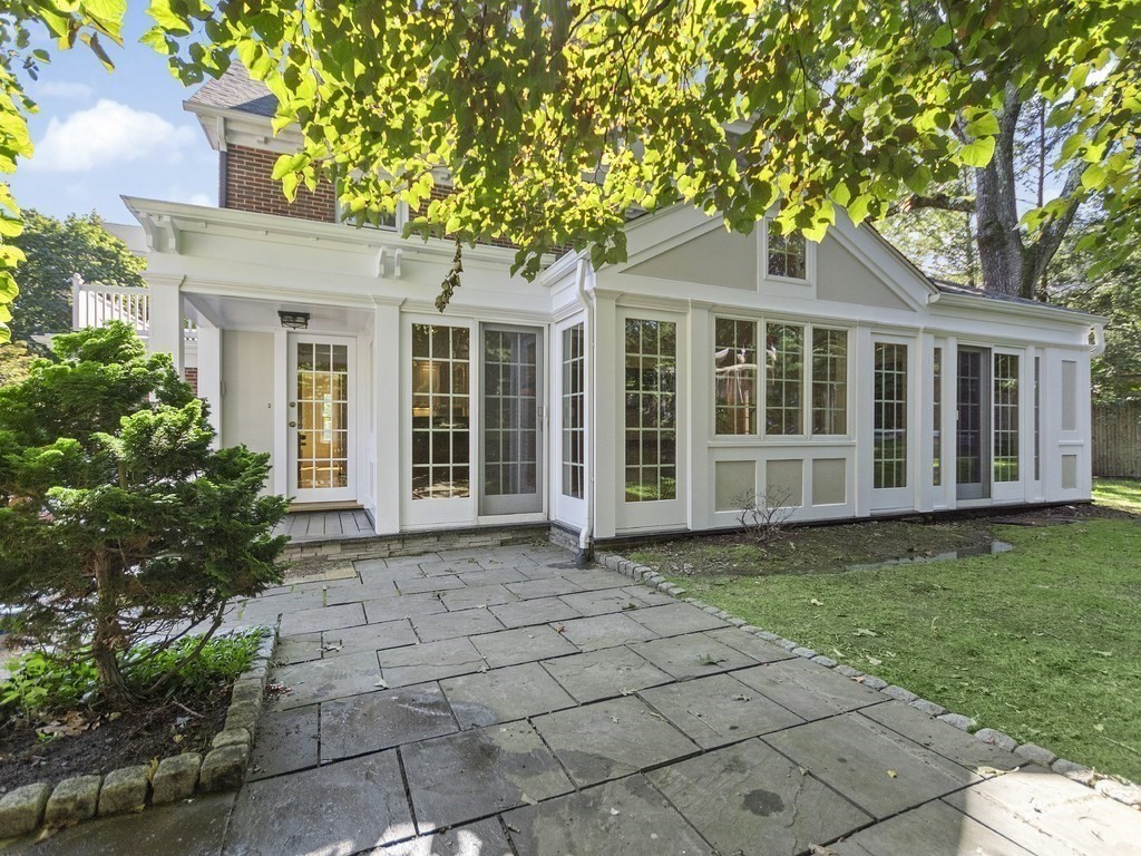 9 Larch Road Newton, MA 02468 - Photo 32 of 34 front view of a house with a garden