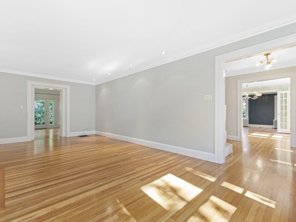 9 Larch Road Newton, MA 02468 - Photo 5 of 34 a view of empty room with wooden floor and fan