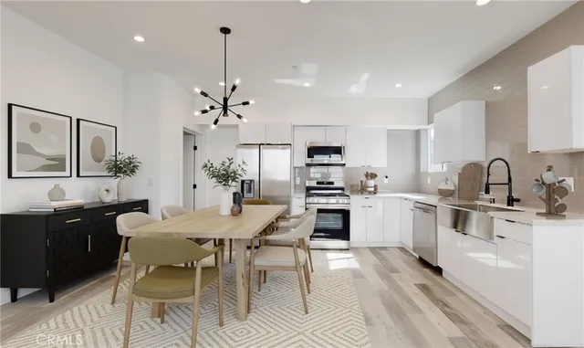 a kitchen with stainless steel appliances kitchen island granite countertop a sink and cabinets