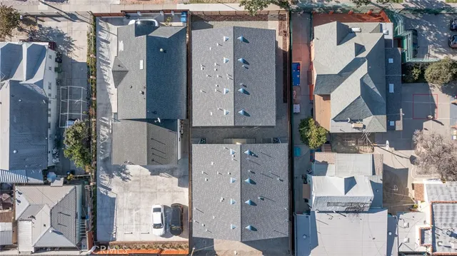 an aerial view of multiple houses with outdoor space