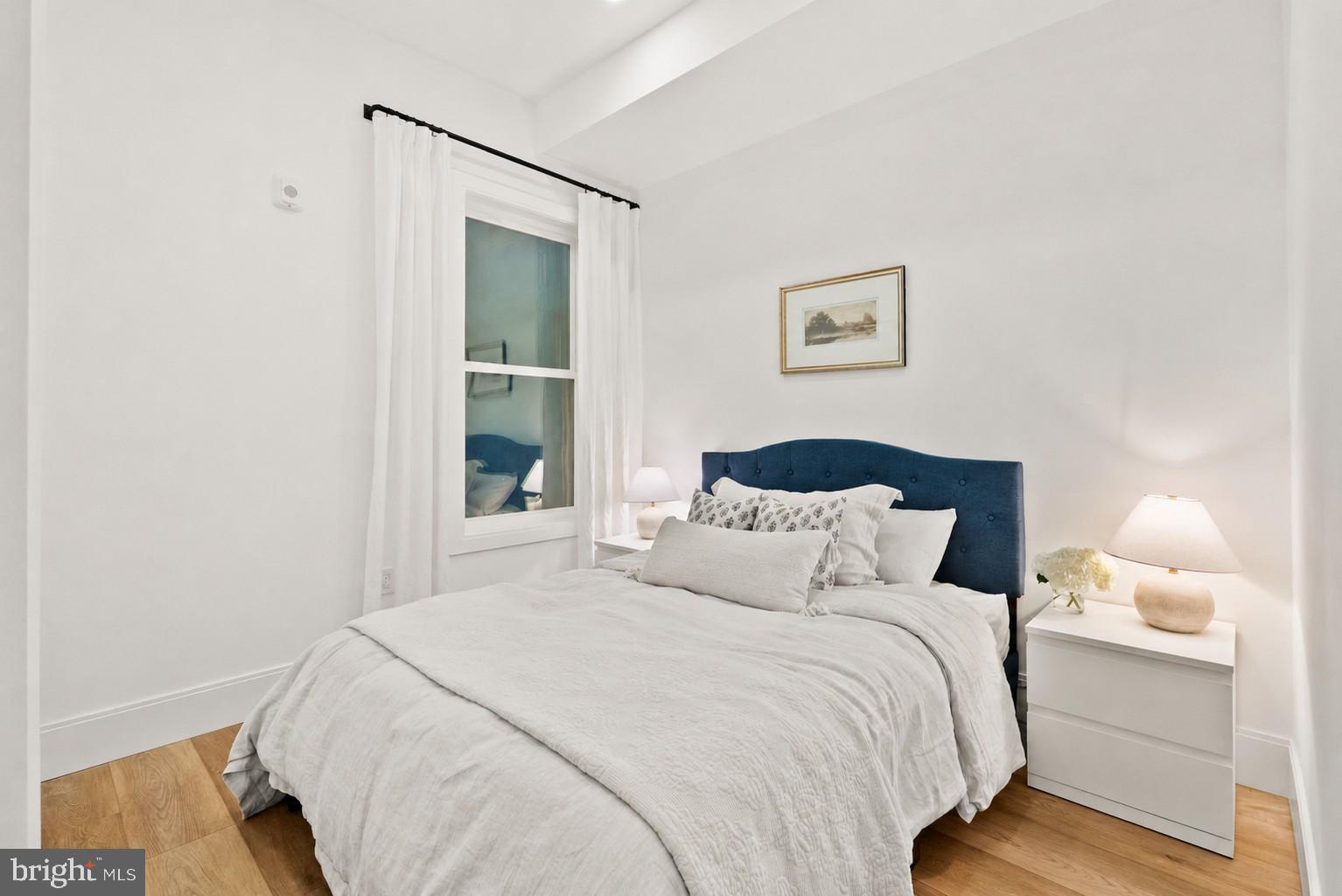 2517 Ontario Road Northwest, Unit 3 Washington, DC 20009 - Photo 8 of 24 Bedroom with high ceilings and hardwood floors