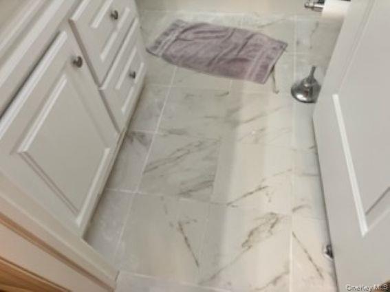 1661 Old Country Road, Unit 166 Riverhead, NY 11901 - Photo 5 of 7 a bathroom with a shower