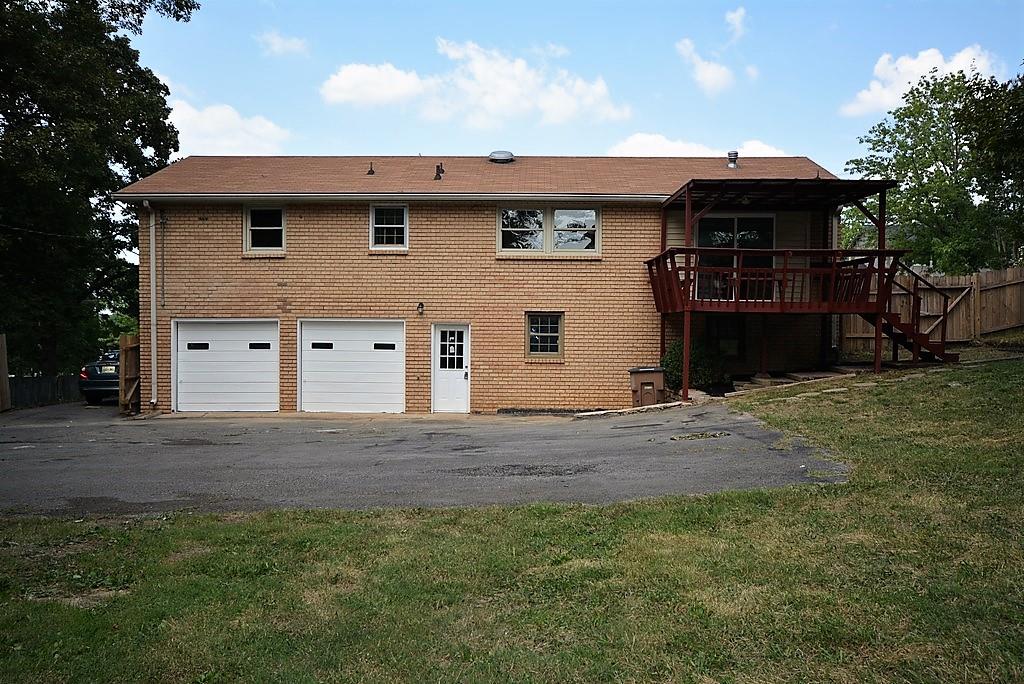 3017 Anderson Road Nashville, TN 37217 - Photo 25 of 29 a front view of a house with a garden