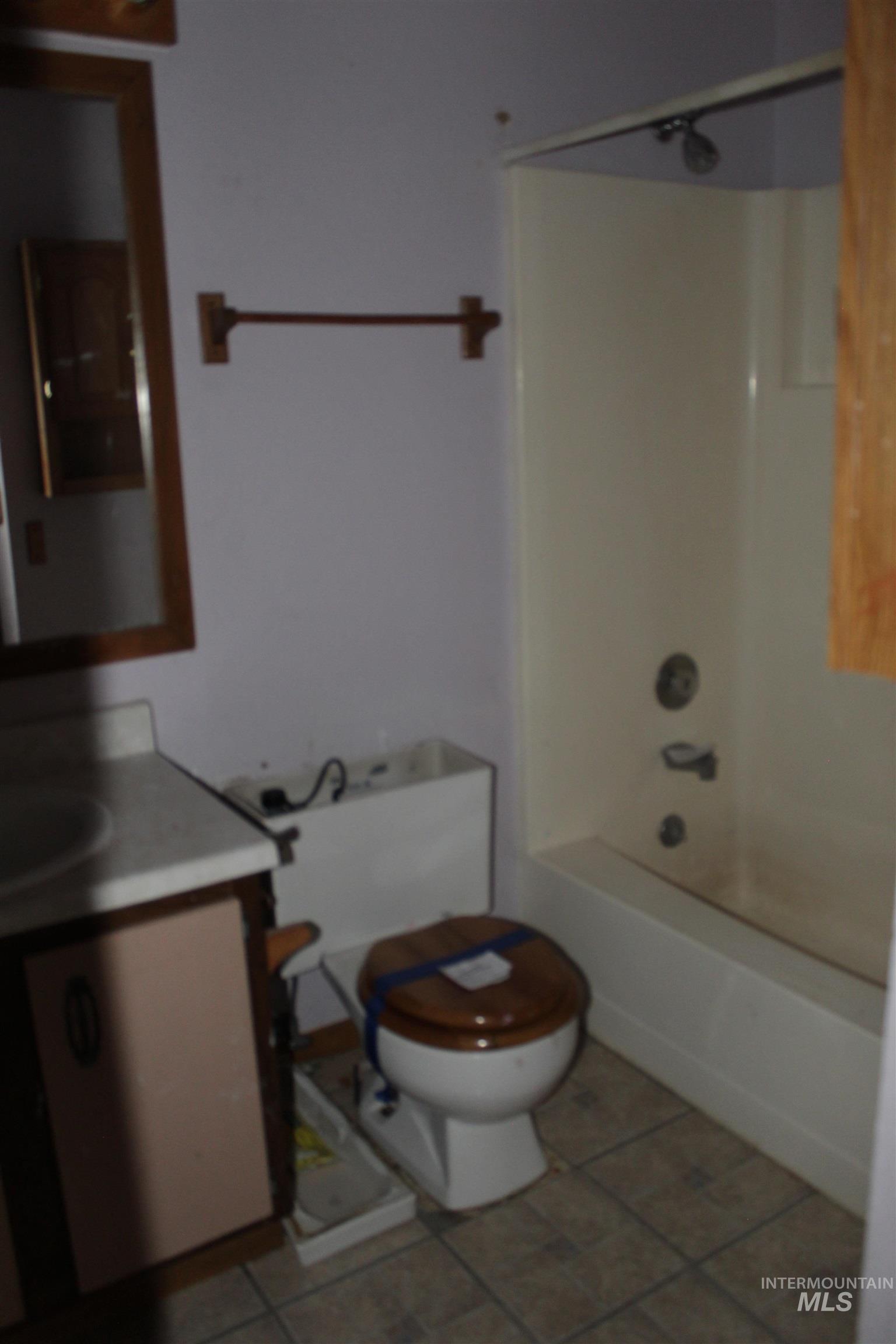 622 East Court Street Weiser, ID 83672 - Photo 13 of 20 Full bath with vanity, shower combination, and light tile patterned floors