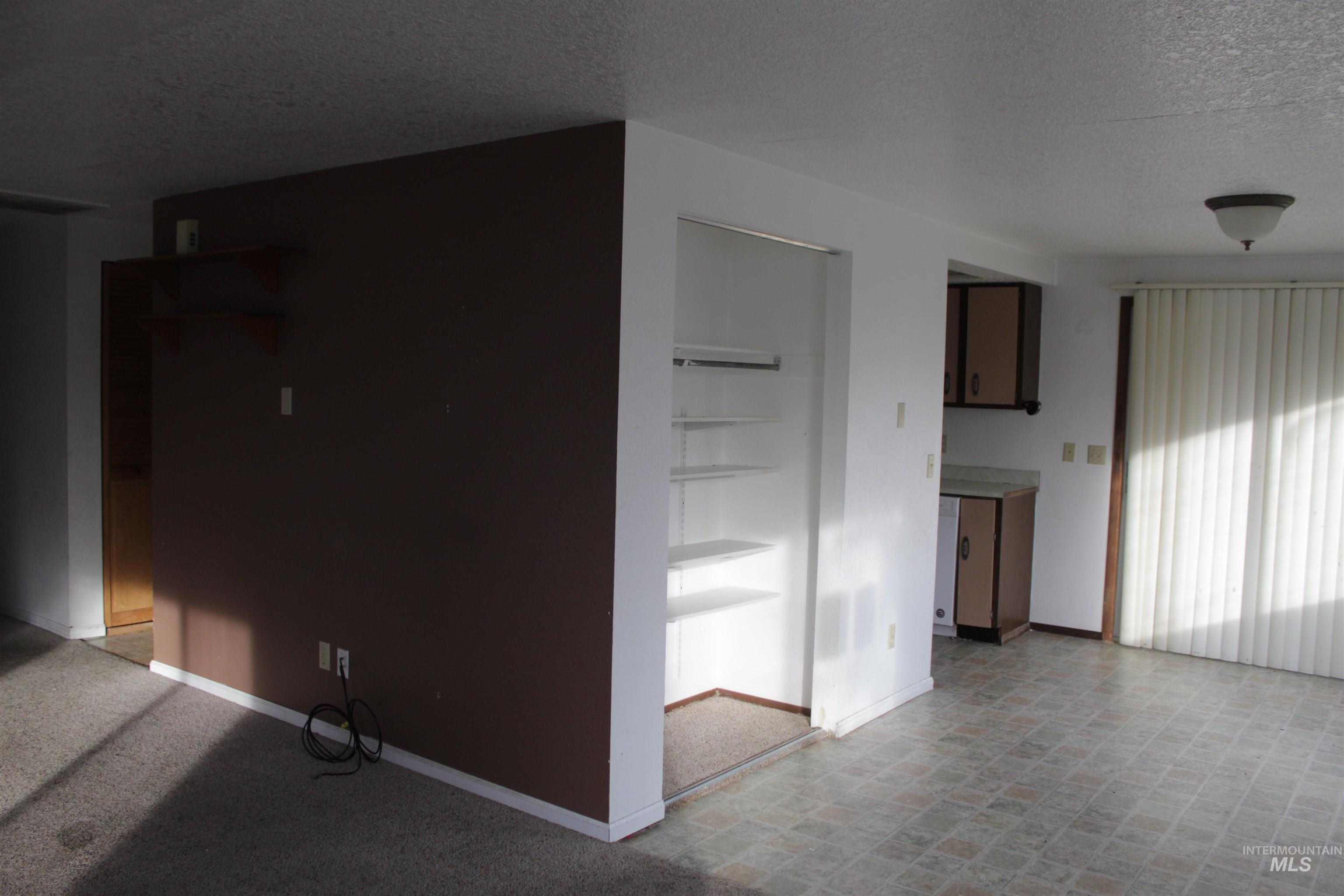 622 East Court Street Weiser, ID 83672 - Photo 8 of 20 Unfurnished room with a textured ceiling and baseboards